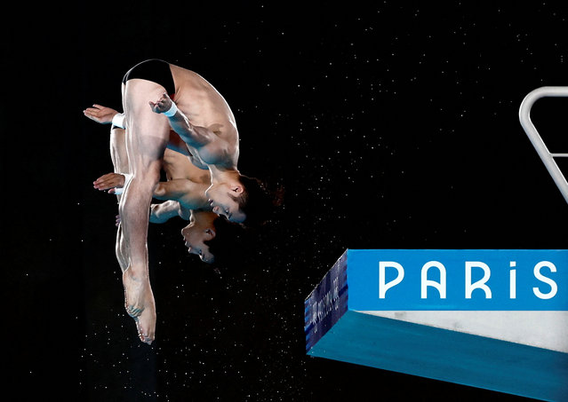 Lian Junjie and Yang Hao of Team China compete during the Diving - Men's Synchronised 10m Platform Final on day three of the Paris 2024 Olympic Games at Aquatics Centre on July 29, 2024 in Saint-Denis, France.. (Photo by Gonzalo Fuentes/Reuters)