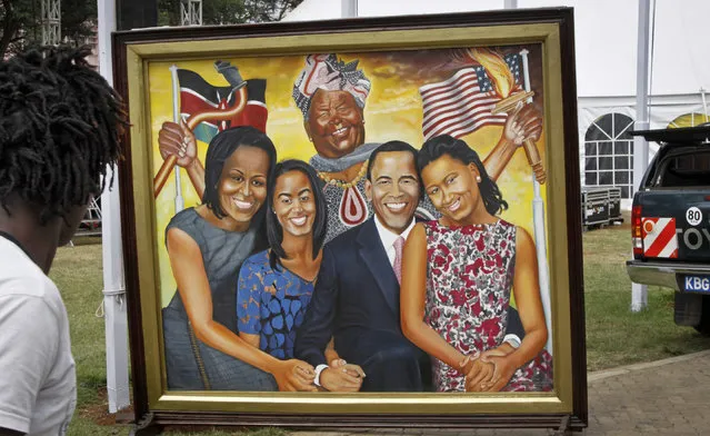 A painting depicting the Obama family and step-grandmother Sarah Obama above, stands outside an exhibition about the Global Entrepreneurship Summit which President Barack Obama will attend later in the week, in Nairobi, Kenya Wednesday, July 22, 2015. In his first trip to Kenya since he was a U.S. senator in 2006, Obama is scheduled to arrive in Kenya on Friday, the first stop on his two-nation African tour in which he will also visit Ethiopia. (Photo by Khalil Senosi/AP Photo)