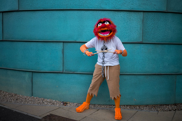 A visitor poses for a picture wearing cosplay costume on the first day of Comic Con Yorkshire at the Yorkshire Events Centre on June 22, 2024 in Harrogate, England. Comic Cons are held worldwide with the purpose of allowing fans to meet their TV and Film heroes, cosplay as their favourite characters and build a community with fellow fans. Based in Harrogate’s Yorkshire Event Centre the Comic Con Yorkshire 2-day event offers entertainment for pop culture fans of all ages, with celebrity Q&A panels, meet and greets and photographs, and behind-the-scenes looks at props and displays. (Photo by Ian Forsyth/Getty Images)