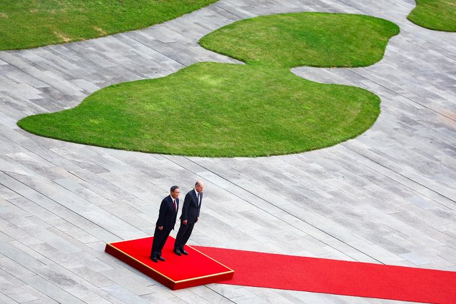 German Chancellor Olaf Scholz and Chinese Premier Li Qiang review the troops during German-Chinese government consultations in Berlin, Germany on June 20, 2023. (Photo by Fabrizio Bensch/Reuters)