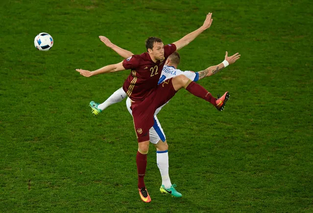 Jan Durica of Slovakia and Artem Dzyuba of Russia batlle for possesion during the UEFA EURO 2016 Group B match between Russia and Slovakia at Stade Pierre-Mauroy on June 15, 2016 in Lille, France. (Photo by Mike Hewitt/Getty Images)