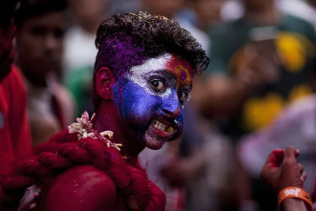 A man dressed as Pothuraju, a mythical character, performs rituals during Bonalu festival in Hyderabad, Sunday, July 16, 2017. Bonalu is a month long Hindu folk festival of the Telangana region dedicated to Kali, the Hindu goddess of destruction. (Photo by Mahesh Kumar A./AP Photo)