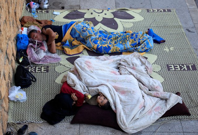 Displaced people sleep along the seaside in western Beirut, amid the ongoing hostilities between Hezbollah and Israeli forces, Lebanon, on October 6, 2024. (Photo by Louisa Gouliamaki/Reuters)