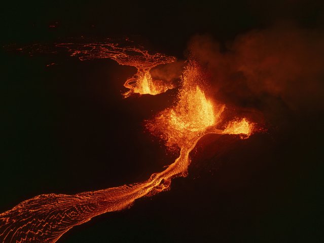 An aerial view of erupting craters and lava flows on the Reykjanes Peninsula, in Iceland, August 29, 2024. (Photo by Marco di Marco/AP Photo)