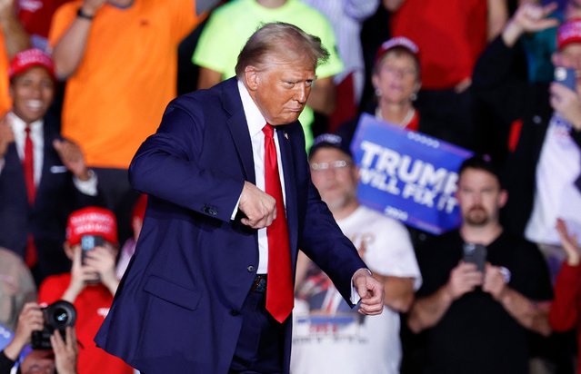 Former US President and Republican presidential candidate Donald Trump dances on stage after speaking at his last campaign rally at Van Andel Arena in Grand Rapids, Michigan on November 5, 2024. (Photo by Kamil Krzaczynski/AFP Photo)