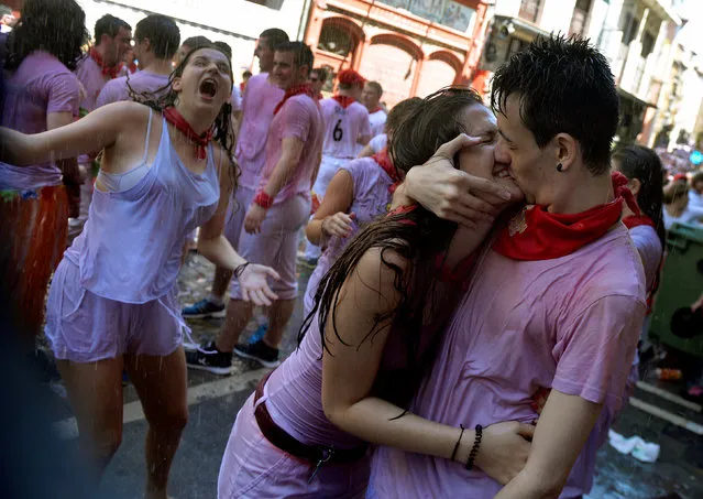  A couple embrace during the start of the San Fermin festival in Pamplona, Spain July 6, 2016. (Photo by Vincent West/Reuters)