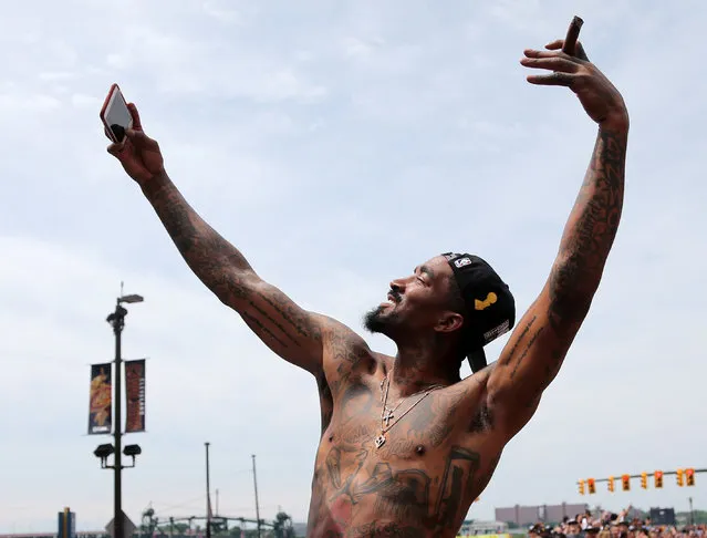 Cleveland Cavaliers JR Smith takes a selfie during a parade to celebrate winning the 2016 NBA Championship in downtown Cleveland, Ohio, U.S. June 22, 2016. (Photo by Aaron Josefczyk/Reuters)