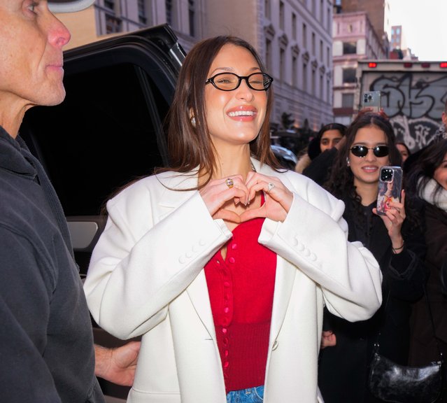 Model Bella Hadid is spotted at the opening of her pop up shop in New York City on December 14, 2024. The 28 year old American wore a red top paired with denim jeans and red heels as she posed outside Orebella, a skin perfume collection founded by the model. (Photo by The Image Direct)