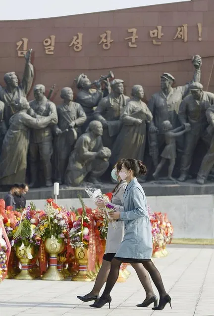 People visit the Mansu Hill to lay flowers to the bronze statues of late leaders Kim Il Sung and Kim Jong Il on the occasion of the 108th birth anniversary of Kim Il Sung in Pyongyang, North Korea Wednesday, April 15, 2020. (Photo by Alamy Live News)