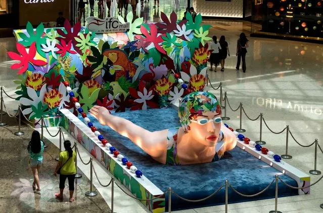 The countdonwn to Rio Olympic Game is on, and shopping malls decorate themselves with swimmer-shaped installation and mini tracks on August 1, 2016 in Shanghai, China. (Photo by Wang Gang/SIPA Press Asia)