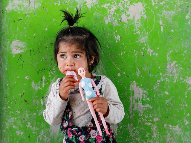 An internally displaced Afghan girl plays outside her shelter, amid the spread of the coronavirus disease (COVID-19), in Kabul, Afghanistan on May 7, 2020. (Photo by Mohammad Ismail/Reuters)
