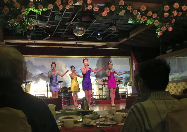 In this February 18, 2016, file photo, North Korean performers entertain customers at the Okryugwan restaurant in Beijing. Chinese news reports Thursday, September 28, 2017, say the government has ordered most North Korean-owned businesses and ventures with Chinese partners to close under U.N. sanctions imposed over the North's nuclear and missile programs. (Photo by Ng Han Guan/AP Photo)