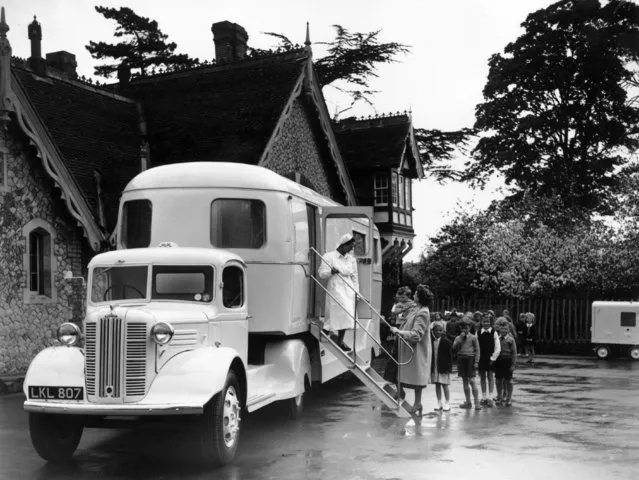 Children at Aylesford entering a mobile dentist and clinic, built for the Kent County Council's school health service for use in areas where village halls and other public buildings are unsuitable. 27th April 1949 (Photo by Topical Press Agency)