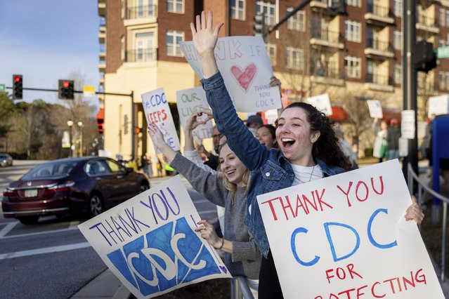 Emory public health students, including Haley Cionfolo, right, cheer in support of Centers for Disease Control and Prevention Photo: CDC) employees leaving the CDC headquarters during a protest against recent CDC layoffs, in Atlanta, Tuesday, February 18, 2025. (Photo by Arvin Temkar/Atlanta Journal-Constitution via AP Photo)