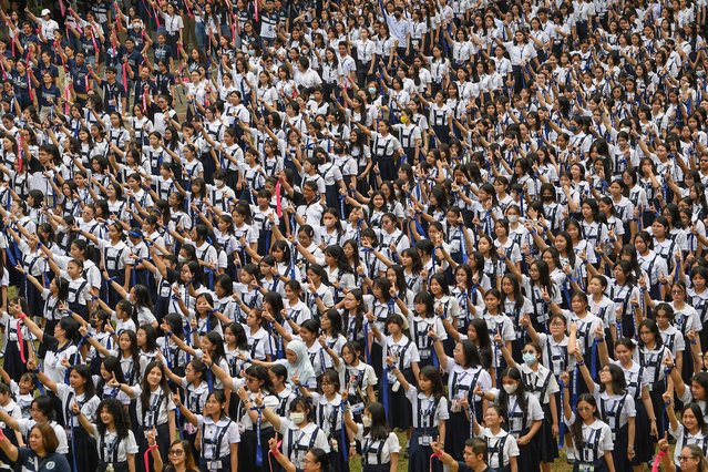 Students dance during global action on violence against women and children dubbed “one billion rising”, to coincide with Valentine's day, at St. Scholastica's College in Manila on February 14, 2025. (Photo by Ted Aljibe/AFP Photo)