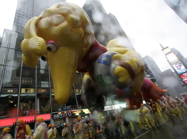 The Big Bird balloon moves through Times Square during the Macy's Thanksgiving Day parade Thursday, November 23, 2006 in New York. (Photo by Frank Franklin II/AP Photo)