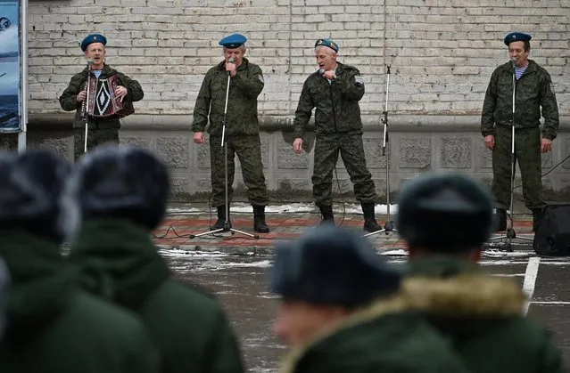A band performs for Russian conscripts, called up for military service during the annual autumn draft, before their departure for garrisons, in Omsk, Russia on November 10, 2022. (Photo by Alexey Malgavko/Reuters)