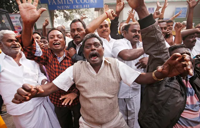 India's former telecommunications minister Andimuthu Raja's supporters celebrate after a hearing outside a court in New Delhi, India, December 21, 2017. (Photo by Adnan Abidi/Reuters)