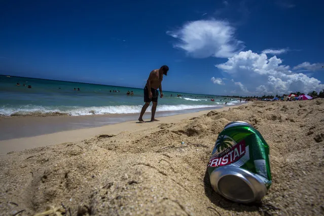 An empty beer can lies on the beach near Havana, Cuba, Thursday, August 18, 2016. Litter is a problem virtually everywhere in the world. But the trashing of Cuba’s world-class beaches by beachgoers themselves has become so extreme that tourists are complaining and Cubans bemoan it as a symptom of something amiss in a nation that’s long cherished cleanliness, order and mutual respect. (Photo by Desmond Boylan/AP Photo)