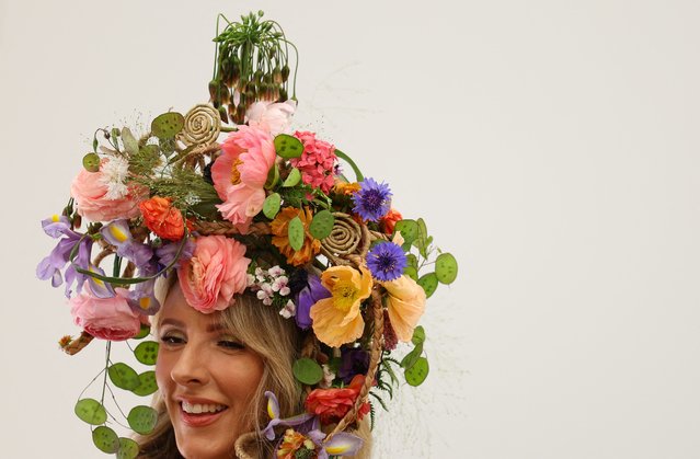 A model wears floral-themed headwear at Chelsea Flower Show, in London, Britain, on May 20, 2024. (Photo by Toby Melville/Reuters)