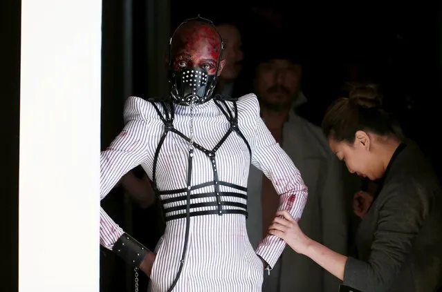 A model waits to present a creation by Chinese designer Hu Sheguang for his collection show during China Fashion Week S/S 2016 in Beijing, October 26, 2015. (Photo by Jason Lee/Reuters)