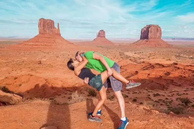 Husband and wife Rob 34 and Joli Switzer 33 from Maryland, perform  their DipKiss pose in Monument Valley in Utah and Arizona. (Photo by Dipkiss Travels/Caters News Agency)