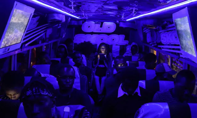 Passengers sit inside a matatu at night in the streets of Nairobi, Kenya, 23 March 2018. (Photo by Daniel Irungu/EPA/EFE)