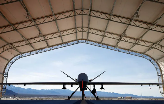 An MQ-9 Reaper remotely piloted aircraft is parked in an aircraft shelter November 17, 2015 at Creech Air Force Base in Indian Springs, Nevada. The Pentagon has plans to expand combat air patrols flights by remotely piloted aircraft by as much as 50 percent over the next few years to meet an increased need for surveillance, reconnaissance and lethal airstrikes in more areas around the world. (Photo by Isaac Brekken/Getty Images)