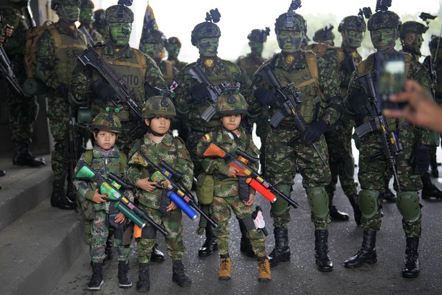 Boys dressed as soldiers pose for a photo during the Independence Day military parade, in Bogota, Colombia, Saturday, July 20, 2024. Colombia is marking 214 years of independence from Spain. (Photo by Fernando Vergara/AP Photo)
