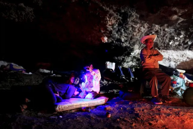 Catholic faithful known as Cumpas rest in a cave during a pilgrimage in the town of Cuishnahuat, El Salvador November 26, 2015. (Photo by Jose Cabezas/Reuters)