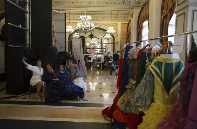 Models pose for a “selfie” backstage during the “We Love Flamenco” fashion show in the Andalusian capital of Seville January 14, 2015. (Photo by Marcelo del Pozo/Reuters)