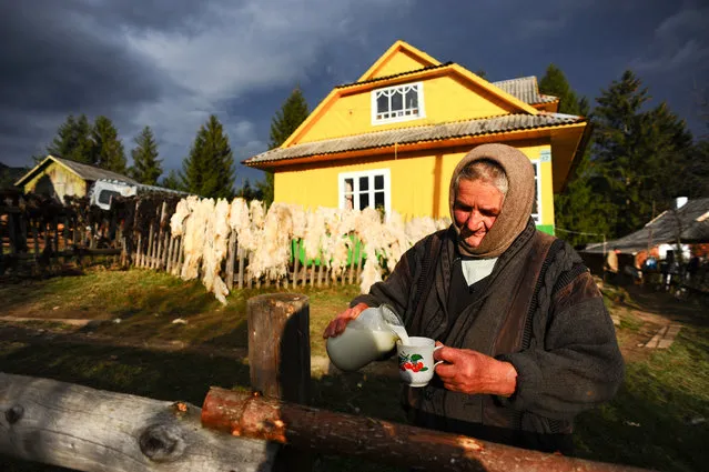 “Fresh milk”. Old lady gladly pours fresh milk to a stranger wondering in mountains. Location: Verkhovina. Carpatian mountains. Ukraine. (Photo and caption by Mstyslav Chernov/National Geographic Traveler Photo Contest)