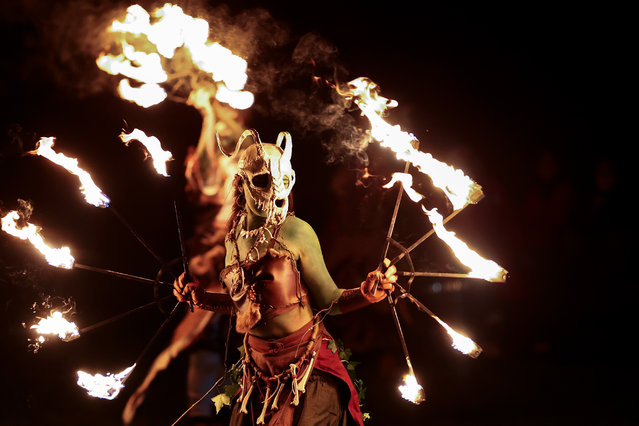 Performers take part in a procession as part of the Samhuinn Fire Festival on October 31, 2024 in Edinburgh, Scotland. The Samhuinn Fire Festival is a modern take on an ancient Celtic festival, marking the transition between summer and winter with fire-dancing, drums, acrobatics, and theatre performances. (Photo by Jeff J. Mitchell/Getty Images)