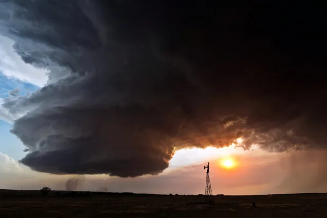 Supercell with windmill, Chappell Nebraska in 2012. (Photo by Camille Seaman/Caters News)