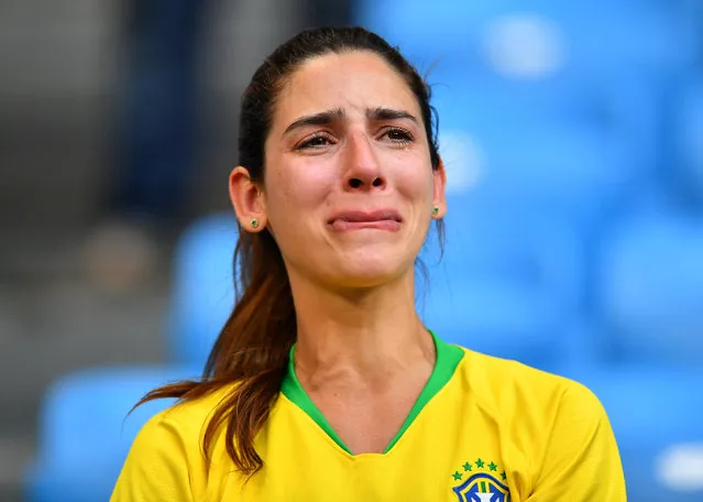 A fan reacts after the football match between Brazil and Mexico at the Samara Arena in Samara on July 2, 2018. (Photo by Dylan Martinez/Reuters)