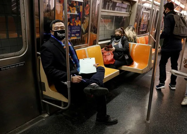 Andrew Yang, democratic candidate for mayor of New York City, rides the subway while campaigning in Brooklyn, New York U.S., March 3, 2021. (Photo by Brendan McDermid/Reuters)