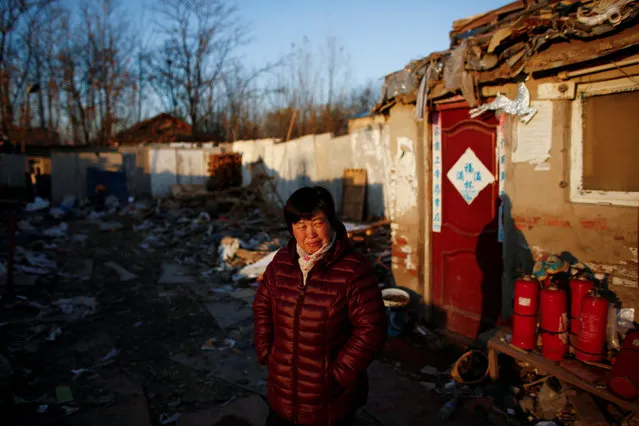 Liu stands in the section of a recycling yard where her family ran a wood collection point, which they cleared out after authorities closed access for deliveries to the facility, in Beijing, China, November 22, 2016. (Photo by Thomas Peter/Reuters)