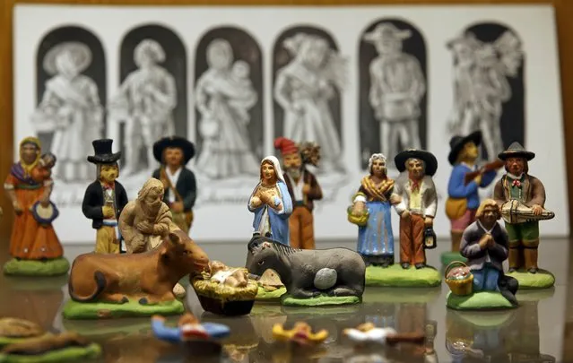 Santons, the typical figurines from Provence, are displayed at the Marcel Carbonel's Santon factory in Marseille, November 28, 2016. (Photo by Jean-Paul Pelissier/Reuters)