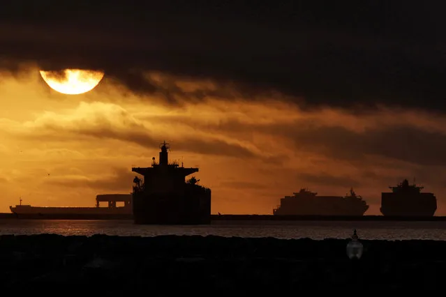 Anchored container ships and with other vessels sit offshore near the ports of Los Angeles and Long Beach December 2, 2012. (Photo by Jonathan Alcorn/Reuters)