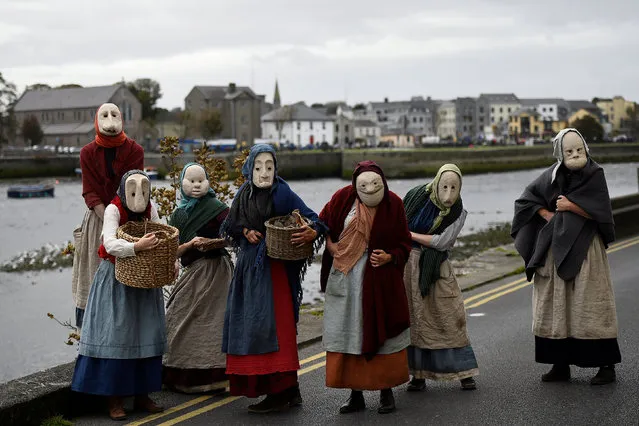 Actors participate in a street performance called “The Fisherwives”, by Bru Theatre group, representing part of the fishing community from 100 years ago, at the Spanish Arch in Galway, Ireland September 30, 2018. (Photo by Clodagh Kilcoyne/Reuters)