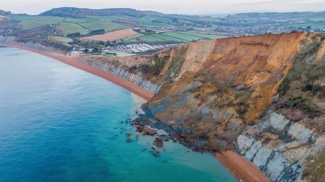 An aerial view of a cliff fall on April 14, 2021 in Seatown, United Kingdom. The 4,000-ton rockfall at Seatown has blocked off the beach between Seatown and Eype Beach, part of Britain's historic Jurassic Coast. The cliff fall is thought to be the biggest in 60 years. Dorset Council has warned that further falls are expected urging residents to stay clear of the area. (Photo by Finnbarr Webster/Getty Images)