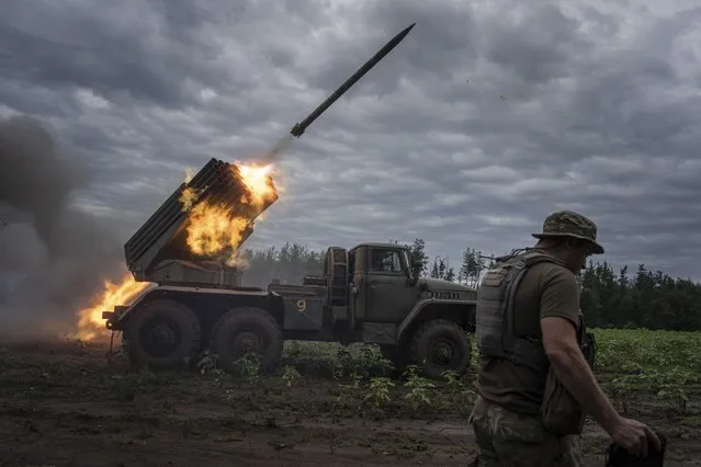 Ukrainian MSLR BM-21 “Grad” shoots toward Russian positions at the frontline in Kharkiv region, Ukraine, on Tuesday, August 2, 2022. (Photo by Evgeniy Maloletka/AP Photo)