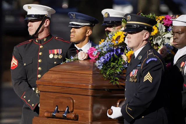 A military team carries the casket of former first lady Rosalynn Carter upon arrival at the Jimmy Carter Presidential Library and Museum, Monday, November 27, 2023, in Atlanta. (Photo by Mike Stewart/AP Photo)