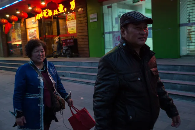 Sarengaowa, left, and Aodengfu, Mongols from Urad Banner, walk in Beijing, where they came with fellow herders to petition the government about abuses by mineral interests. Sarengaowa was detained for 15 days for participating in a similar protest in 2013. (Photo by Gilles Sabrie/The Washington Post)