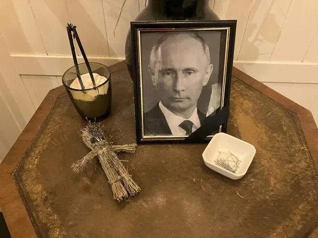 A doll, a bowl of pins and a framed photo of Russian President Vladimir Putin are displayed for customers’ use at the Simona pizzeria in central Kyiv on November 17, 2022. Plenty of customers clearly felt the cathartic need to vent their anger against the Russia leader: the doll was pin-stuck from head nearly to toe. The hard realities of Ukraine’s capital are that a once comfortably livable city of 3 million people is now becoming a tough place to live. But Kyiv has hope, resilience and defiance in abundance. And perhaps more so now than at any time since Russia invaded Ukraine nine months ago. (Photo by John Leicester/AP Photo)