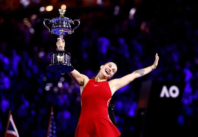 Belarus' Aryna Sabalenka celebrates with the trophy after winning the final against China's Qinwen Zheng at the Australian Open in Melbourne, Australia on January 28, 2024. (Photo by Issei Kato/Reuters)
