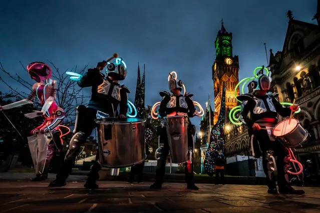 Drummers from Global Grooves perform at City Park in Bradford, United Kingdom during the opening night of the Bradford Science Festival on Saturday, October 23, 2021. (Photo by Danny Lawson/PA Images via Getty Images)