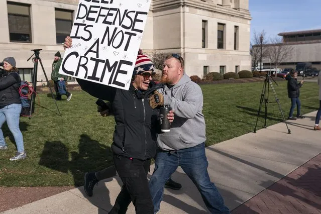 Emily Chaill, a supporter of Kyle Rittenhouse, reacts as a not guilt verdict is read while another man moves her away from an opposing crowd in front of the Kenosha County Courthouse on November 19, 2021 in Kenosha, Wisconsin. t the Kenosha County Courthouse on November 19, 2021 in Kenosha, Wisconsin. Rittenhouse was found not guilty of all charges in the shooting of three demonstrators, killing two of them, during a night of unrest that erupted in Kenosha after a police officer shot Jacob Blake seven times in the back while being arrested in August 2020. Rittenhouse, from Antioch, Illinois, claimed self defense who at the time of the shooting was armed with an assault rifle. (Photo by Nathan Howard/Getty Images)