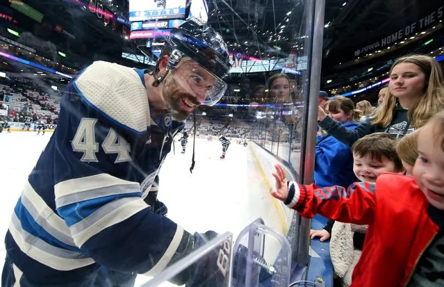 Columbus Blue Jackets defenseman Erik Gudbranson (44) greets his 4-year-old daughter Zoey before an NHL hockey game against against the New York Islanders, Thursday, April 4, 2024, in Columbus, Ohio. (Photo by Joe Maiorana/AP Photo)