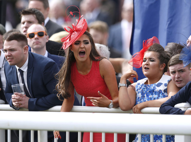 Racegoers watch the racing at the Grand National Festival on Ladies Day of the Crabbie's Grand National Festival at Aintree Racecourse on April 8, 2016 in Liverpool, England. (Photo by Andrew Boyers/Reuters/Livepic)
